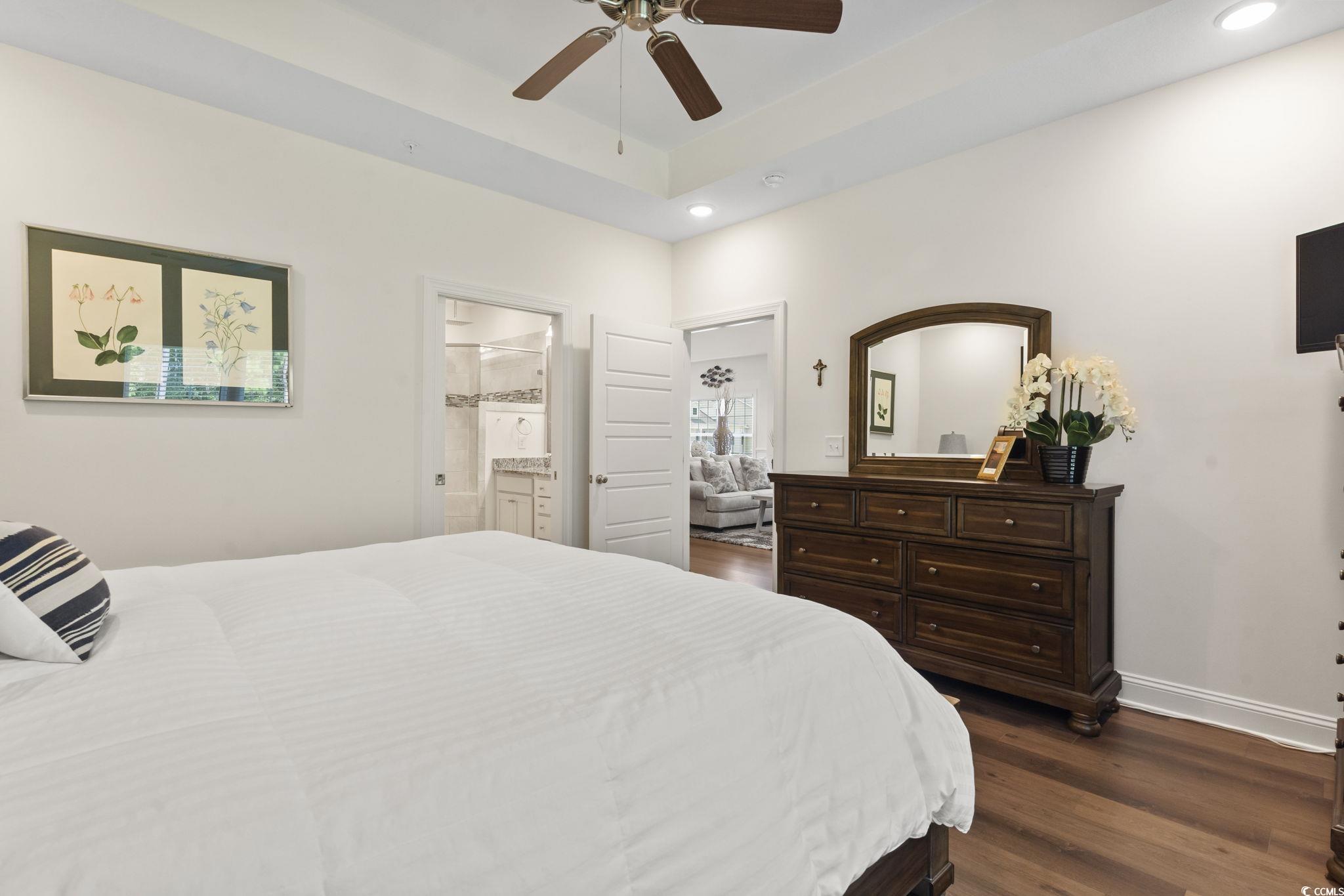 924 Jackline Place, Unit 201 Murrells Inlet, SC 29576 - Photo 26 of 35 Bedroom with dark wood-style floors, a ceiling fan, recessed lighting, and ensuite bathroom