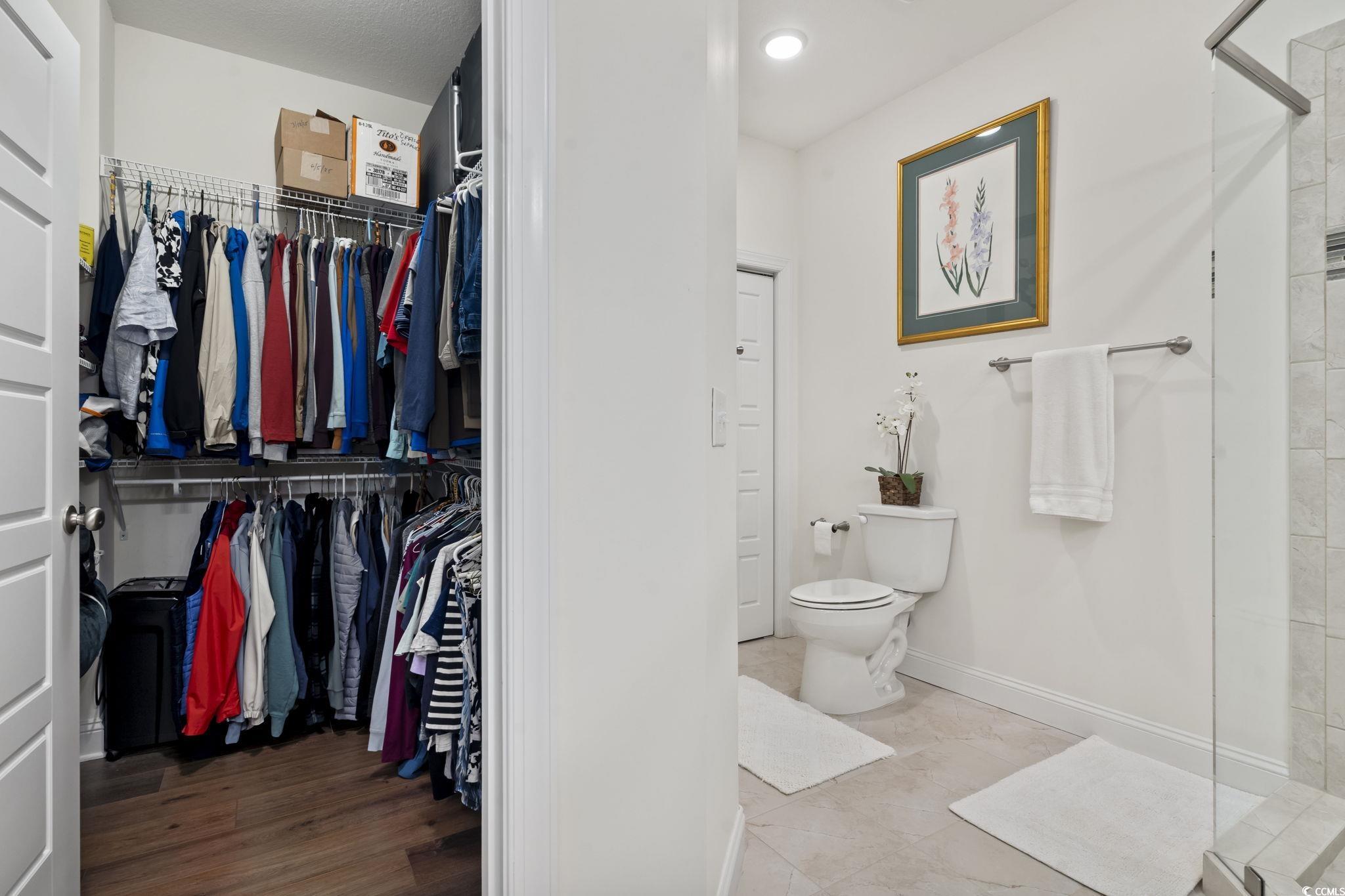 924 Jackline Place, Unit 201 Murrells Inlet, SC 29576 - Photo 27 of 35 Full bath with a shower stall and a spacious closet