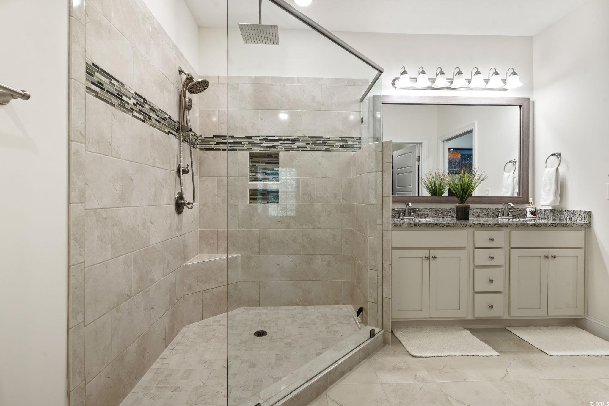 924 Jackline Place, Unit 201 Murrells Inlet, SC 29576 - Photo 29 of 35 Full bath with a walk in shower and double vanity