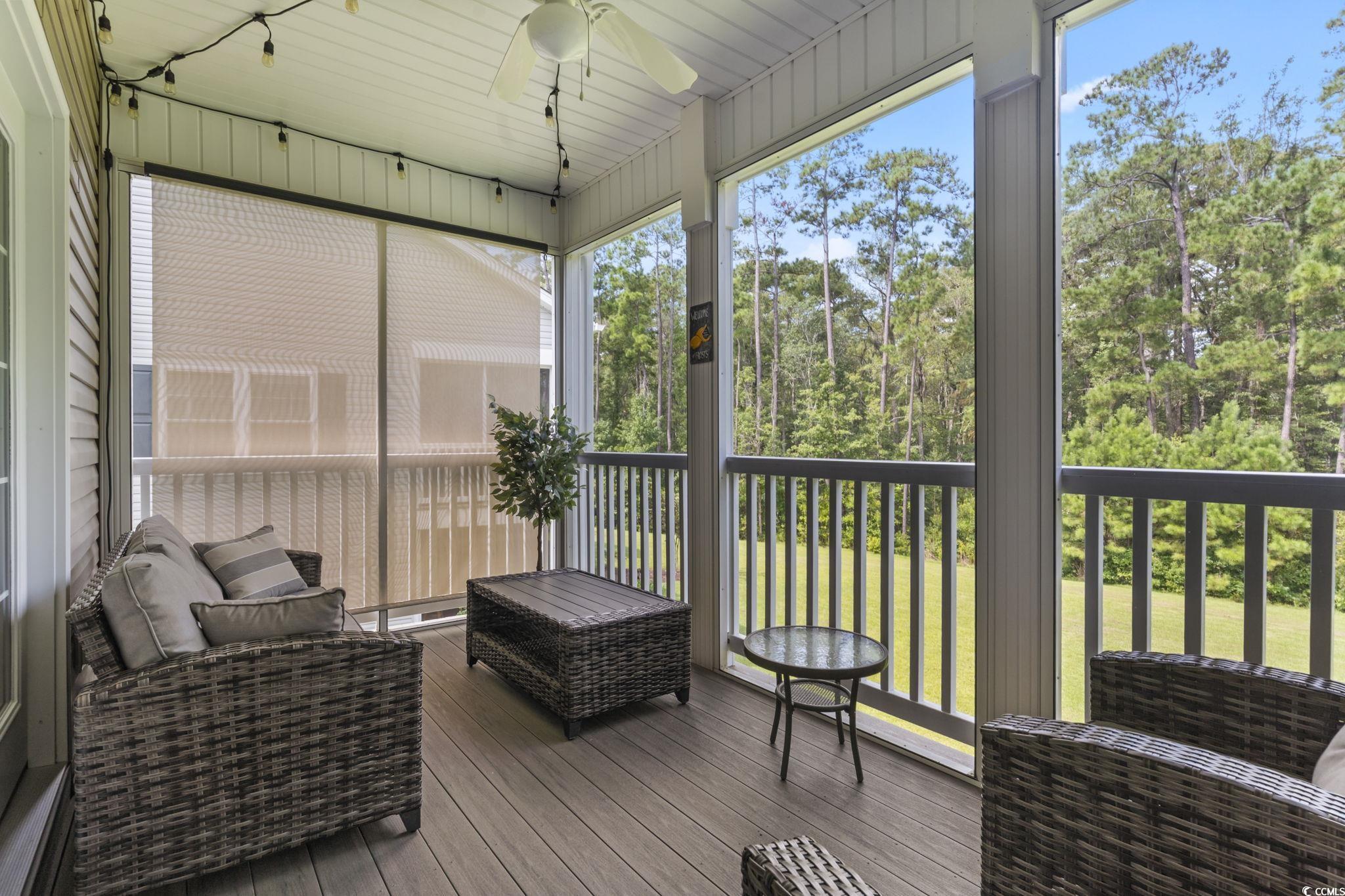 924 Jackline Place, Unit 201 Murrells Inlet, SC 29576 - Photo 32 of 35 Sunroom with a ceiling fan, plenty of natural light, and an outdoor hangout area
