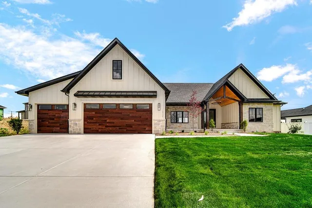 a front view of house with yard and green space