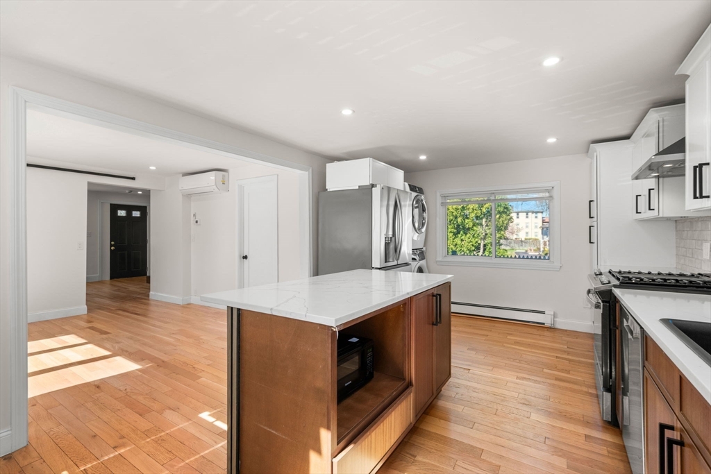 271 Broadway Haverhill, MA 01832 - Photo 14 of 41 a kitchen with stainless steel appliances granite countertop a stove and a sink
