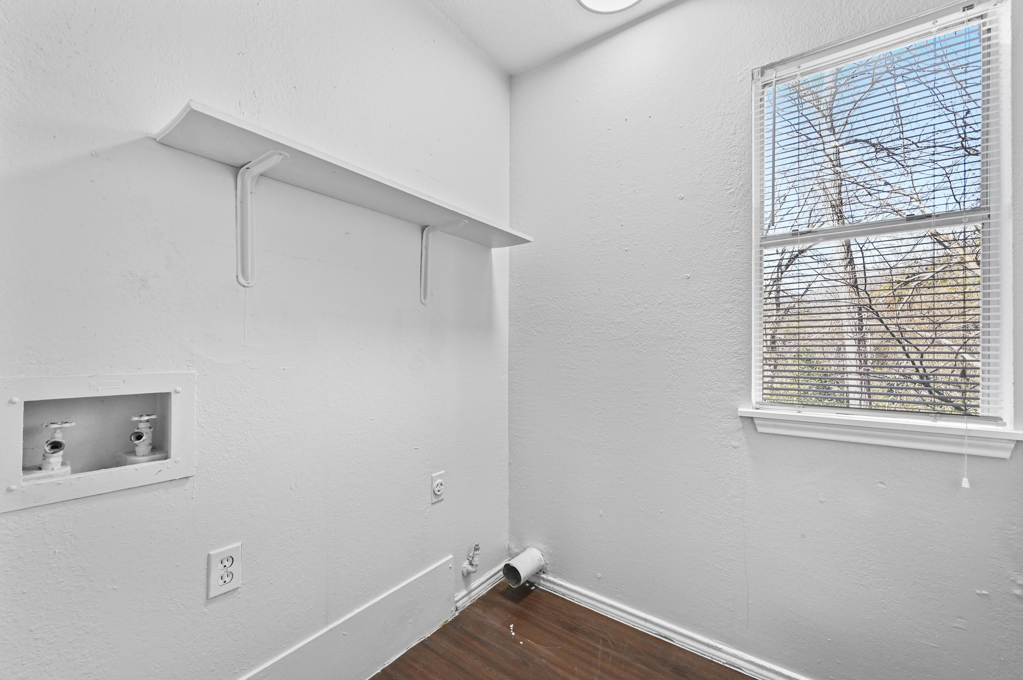 5303 Spring Meadow Road Austin, TX 78744 - Photo 11 of 20 a view of an empty room with a window