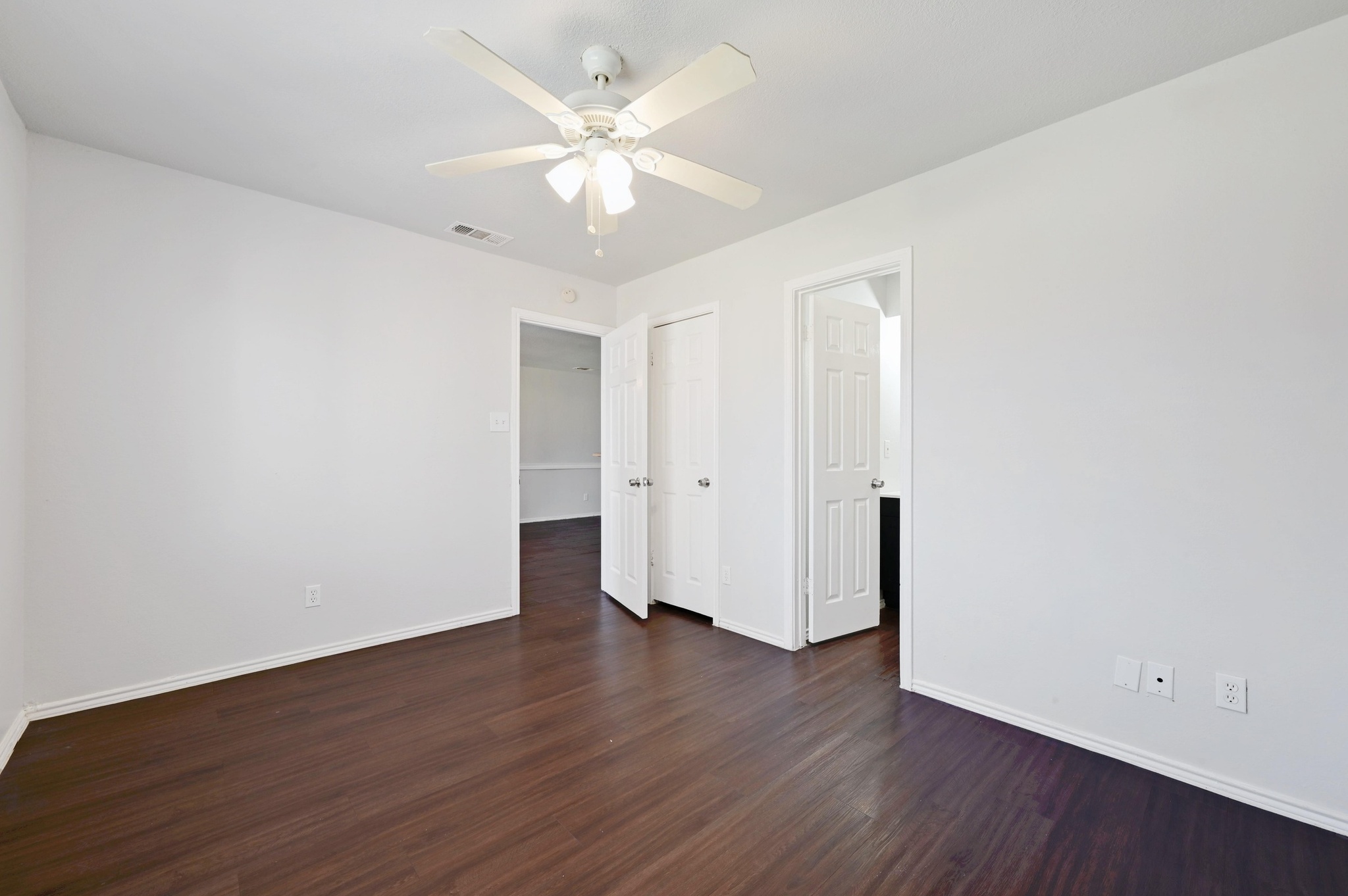 5303 Spring Meadow Road Austin, TX 78744 - Photo 14 of 20 an empty room with wooden floor and window