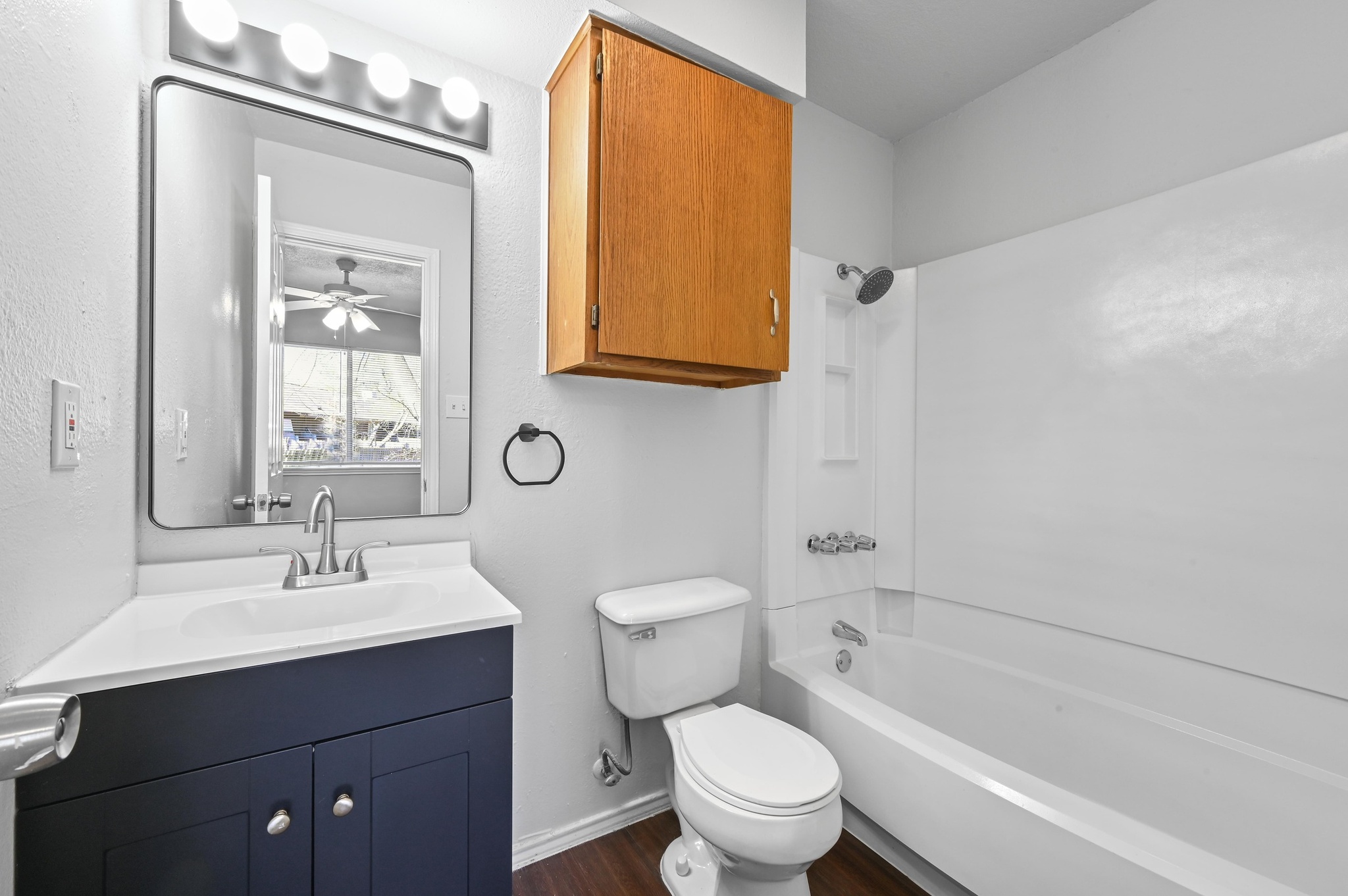 5303 Spring Meadow Road Austin, TX 78744 - Photo 15 of 20 a bathroom with a sink a toilet and shower