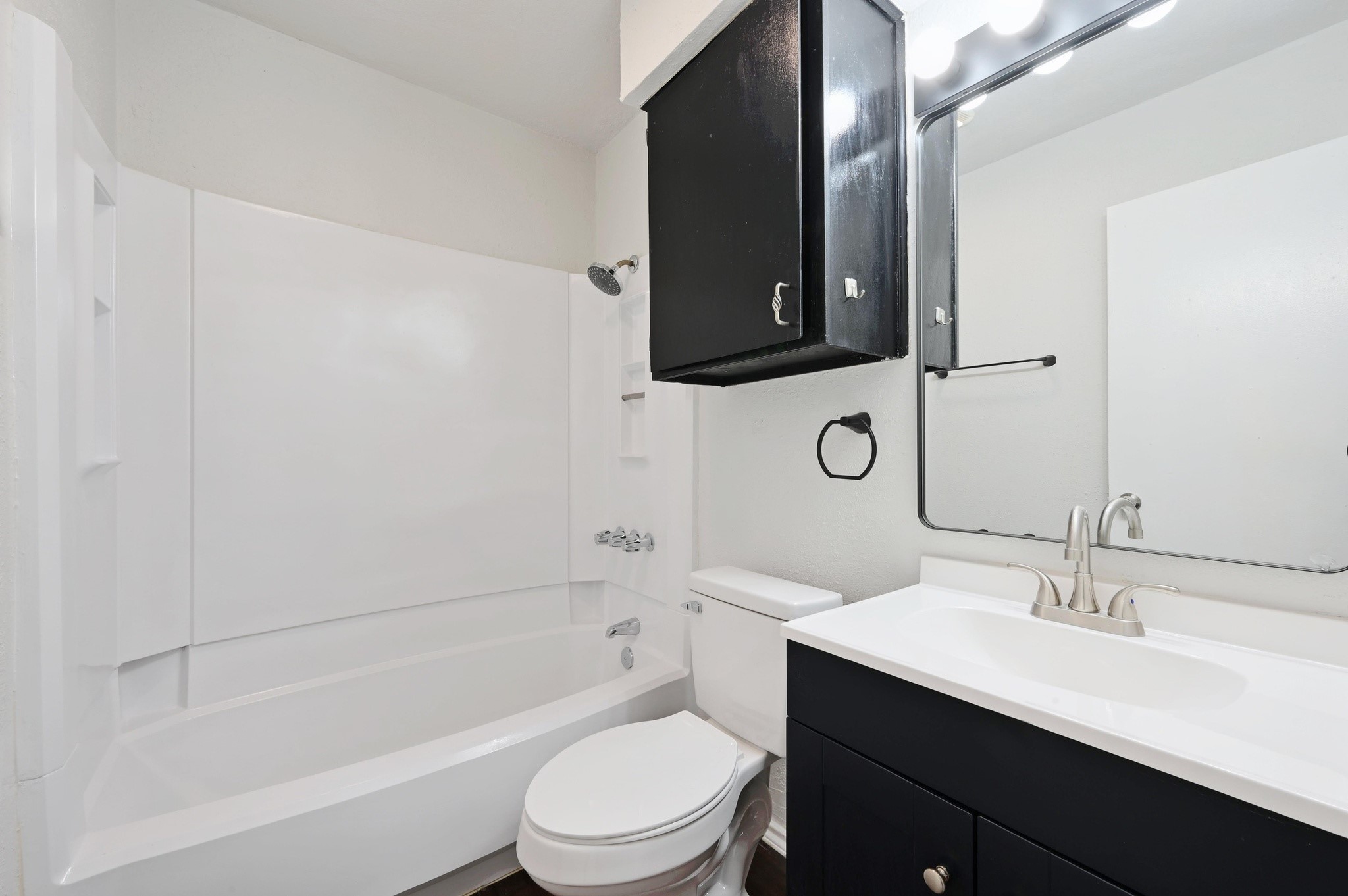 5303 Spring Meadow Road Austin, TX 78744 - Photo 18 of 20 a bathroom with a bathtub sink mirror vanity and toilet