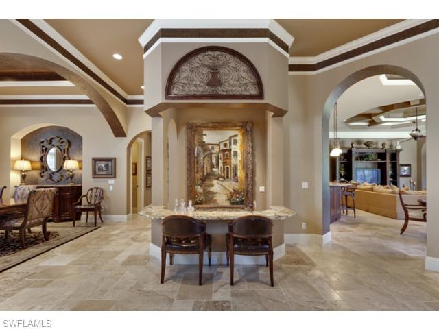 29031 Amarone Court Naples, FL 34110 - Photo 5 of 8 a view of a livingroom with furniture mirror and furniture