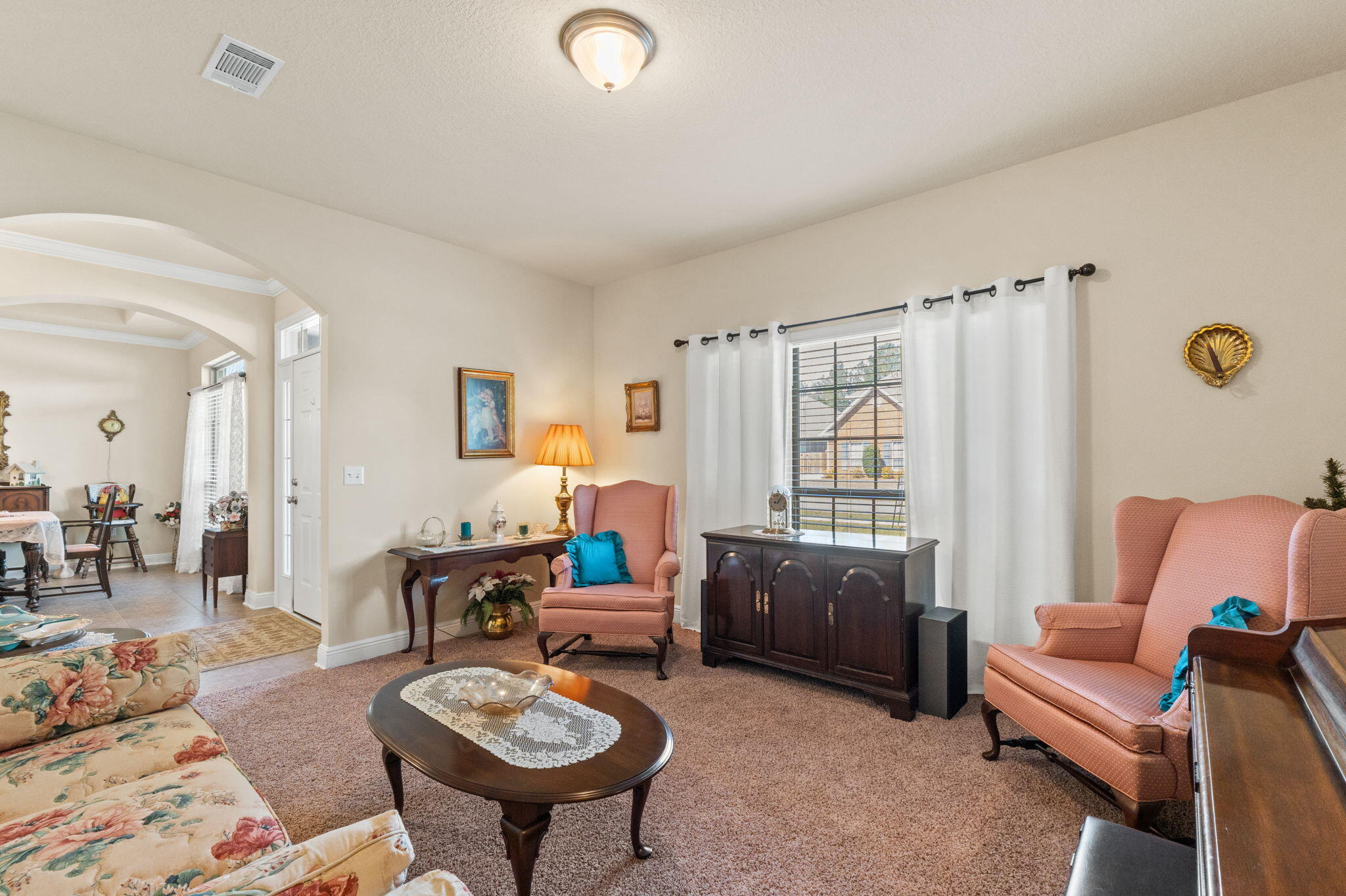 67 Secret Street Freeport, FL 32439 - Photo 11 of 63 a living room with furniture a rug and a window