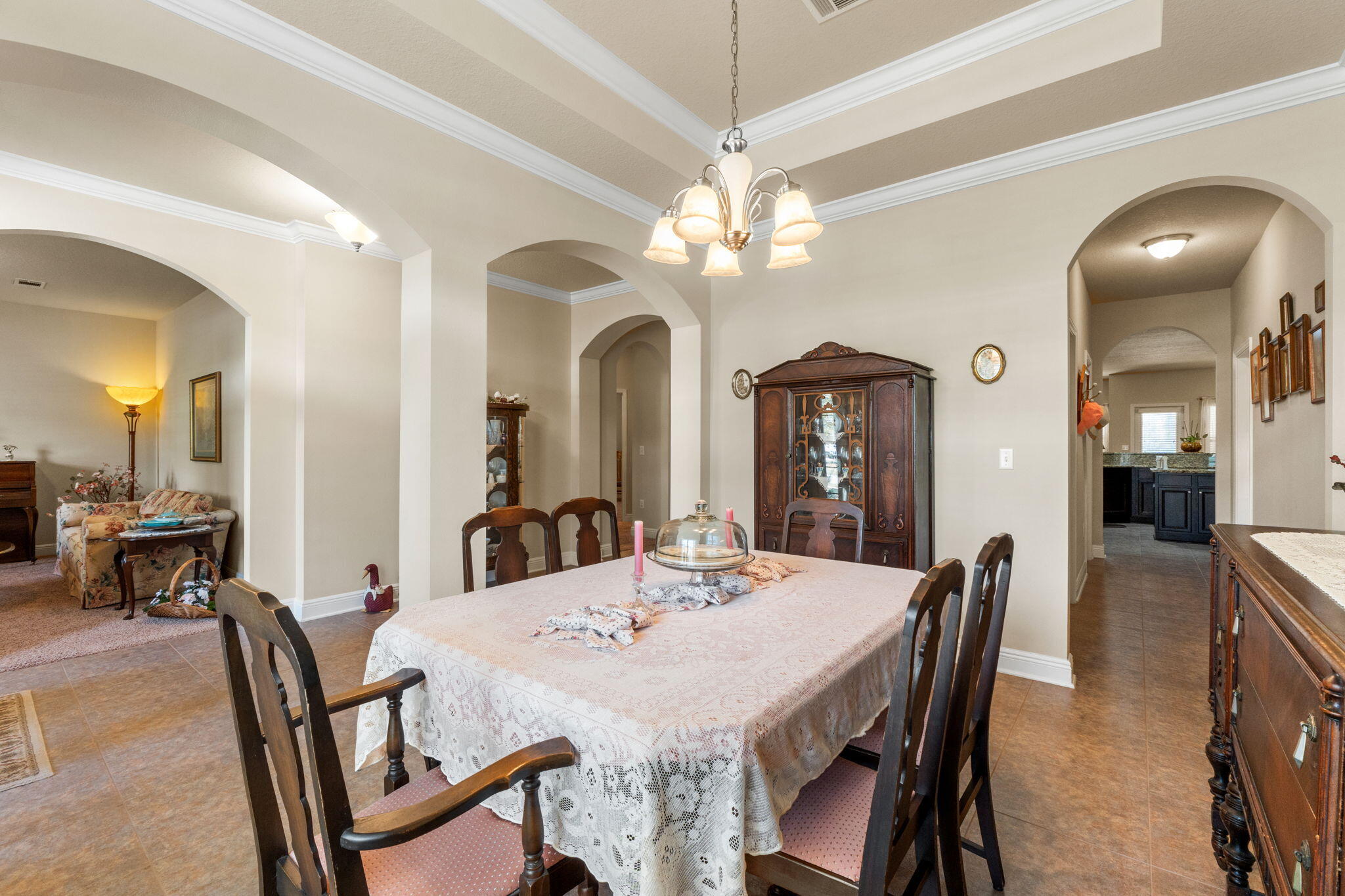 67 Secret Street Freeport, FL 32439 - Photo 15 of 63 a view of a dining room with furniture and a chandelier