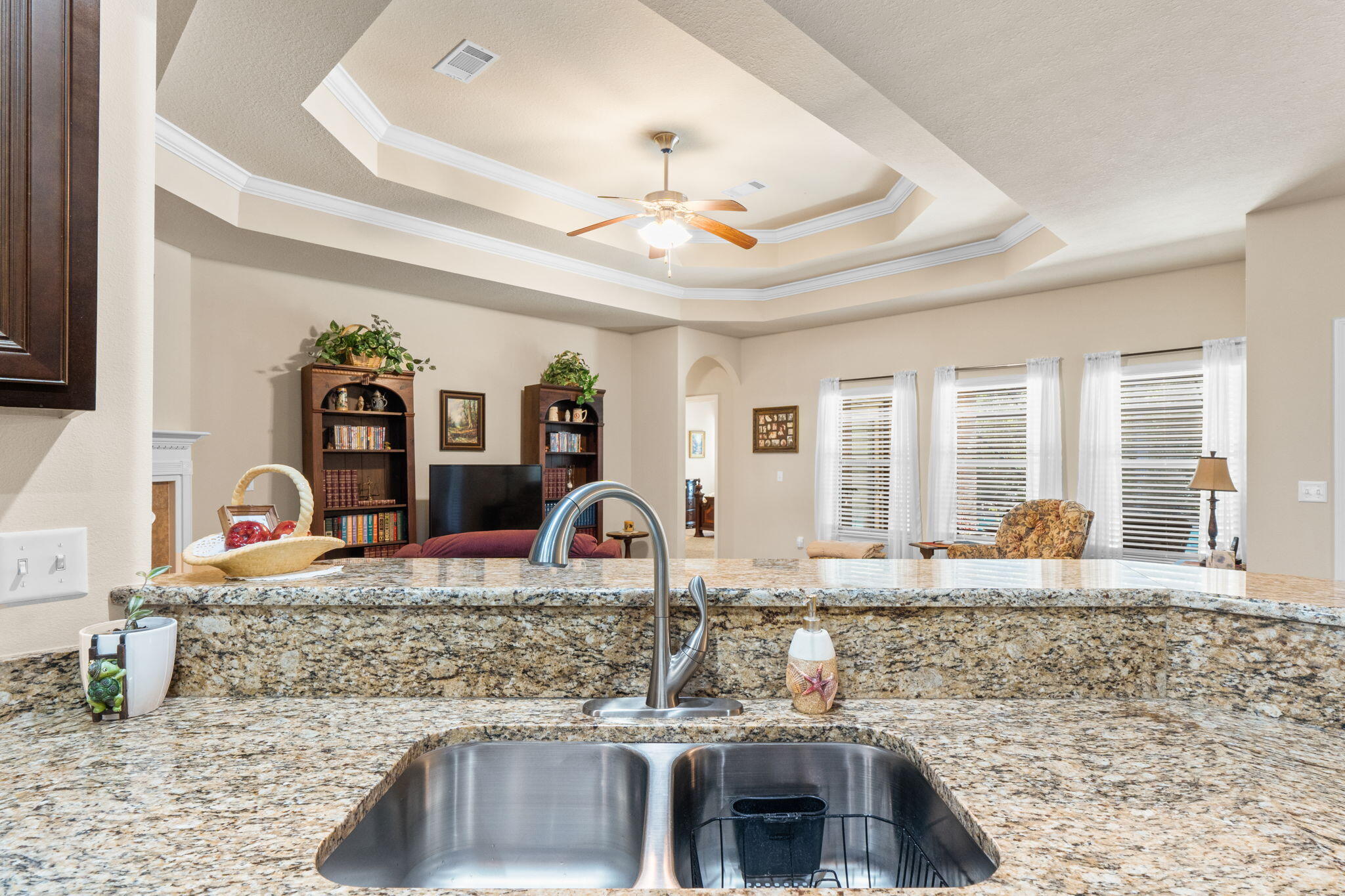 67 Secret Street Freeport, FL 32439 - Photo 23 of 63 a kitchen with granite countertop a stove a sink and a granite counter tops