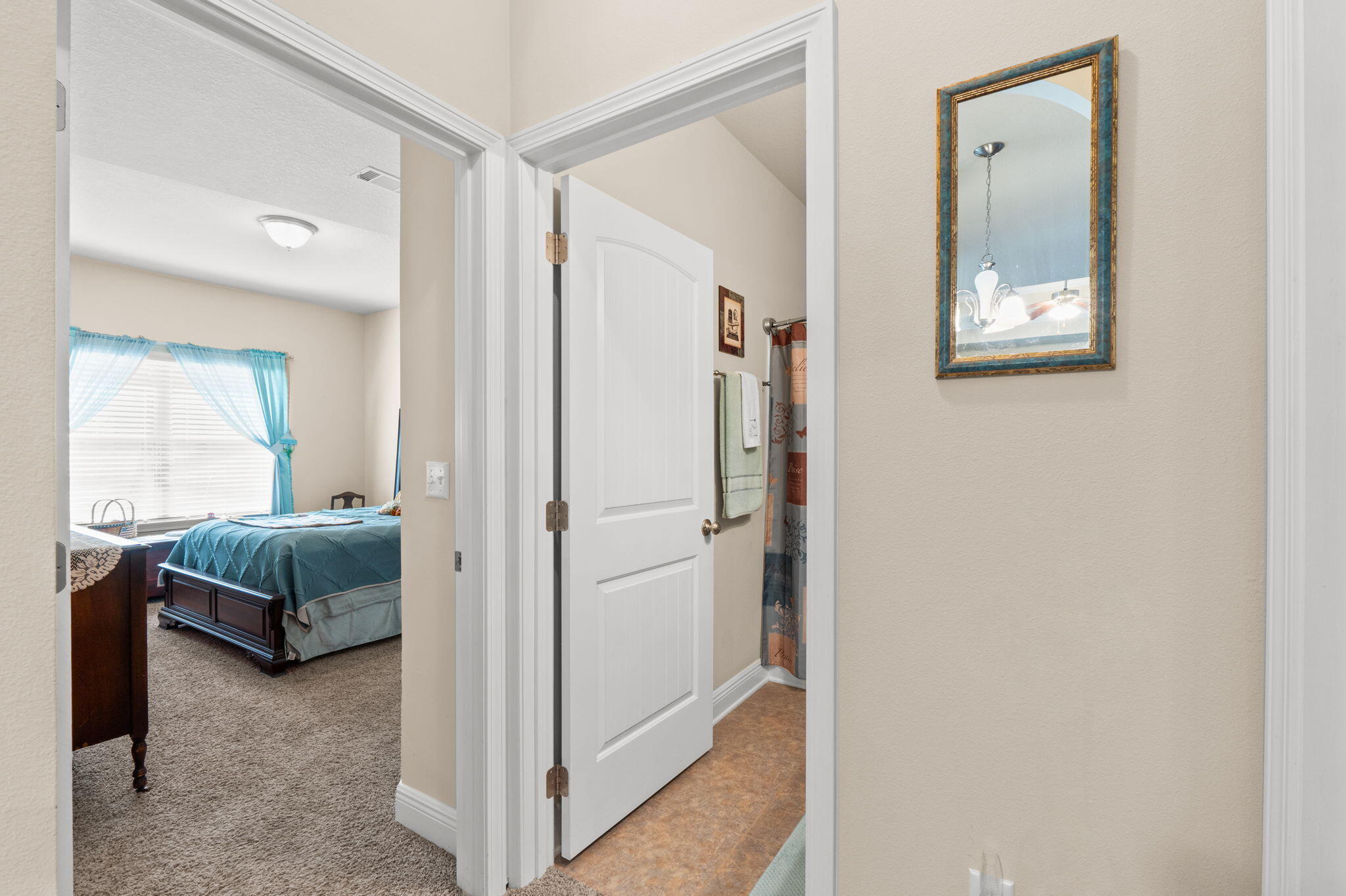 67 Secret Street Freeport, FL 32439 - Photo 28 of 63 a bedroom with a bed and a couch