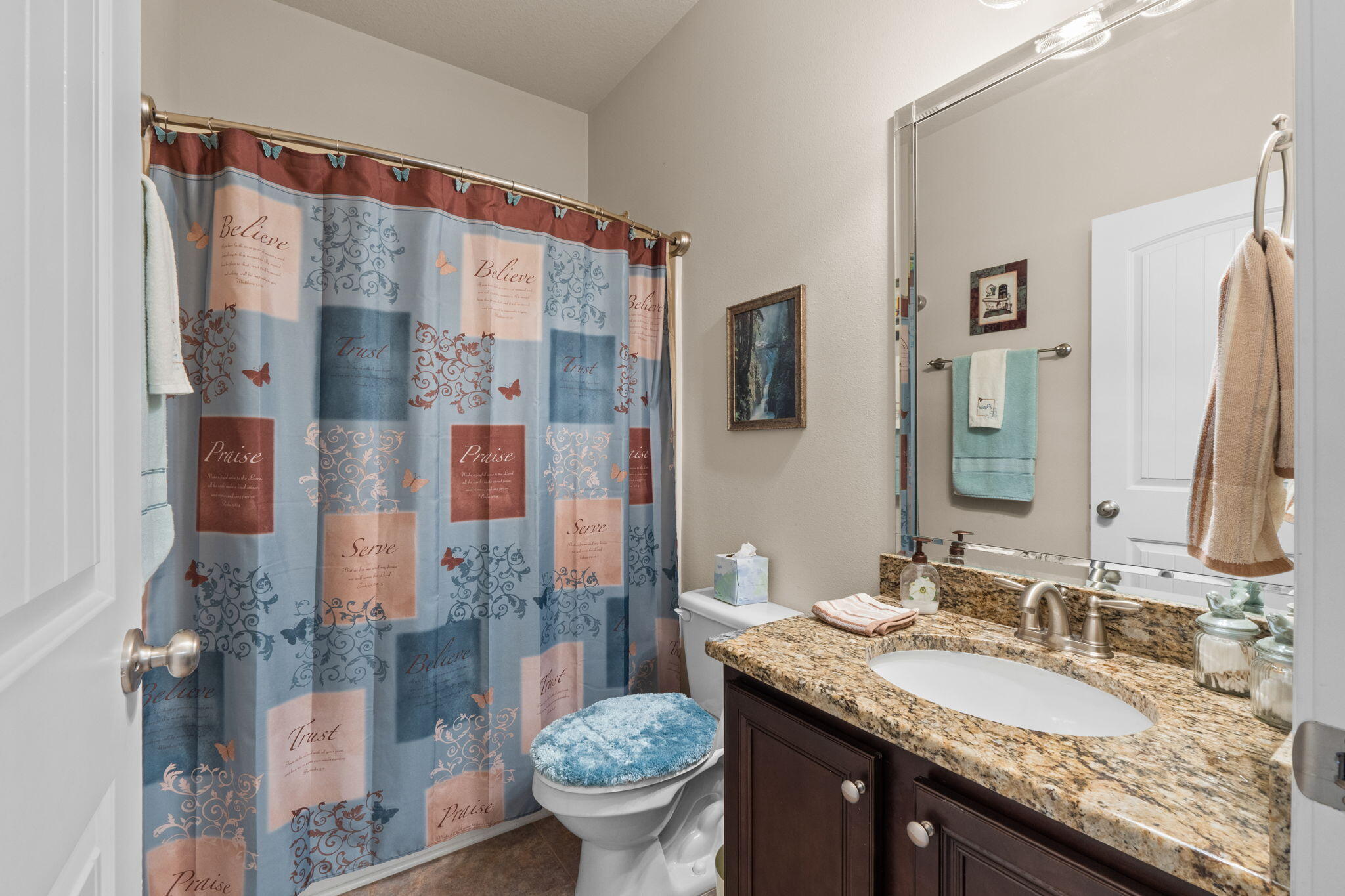 67 Secret Street Freeport, FL 32439 - Photo 29 of 63 a bathroom with a granite countertop double vanity sink mirror and shower