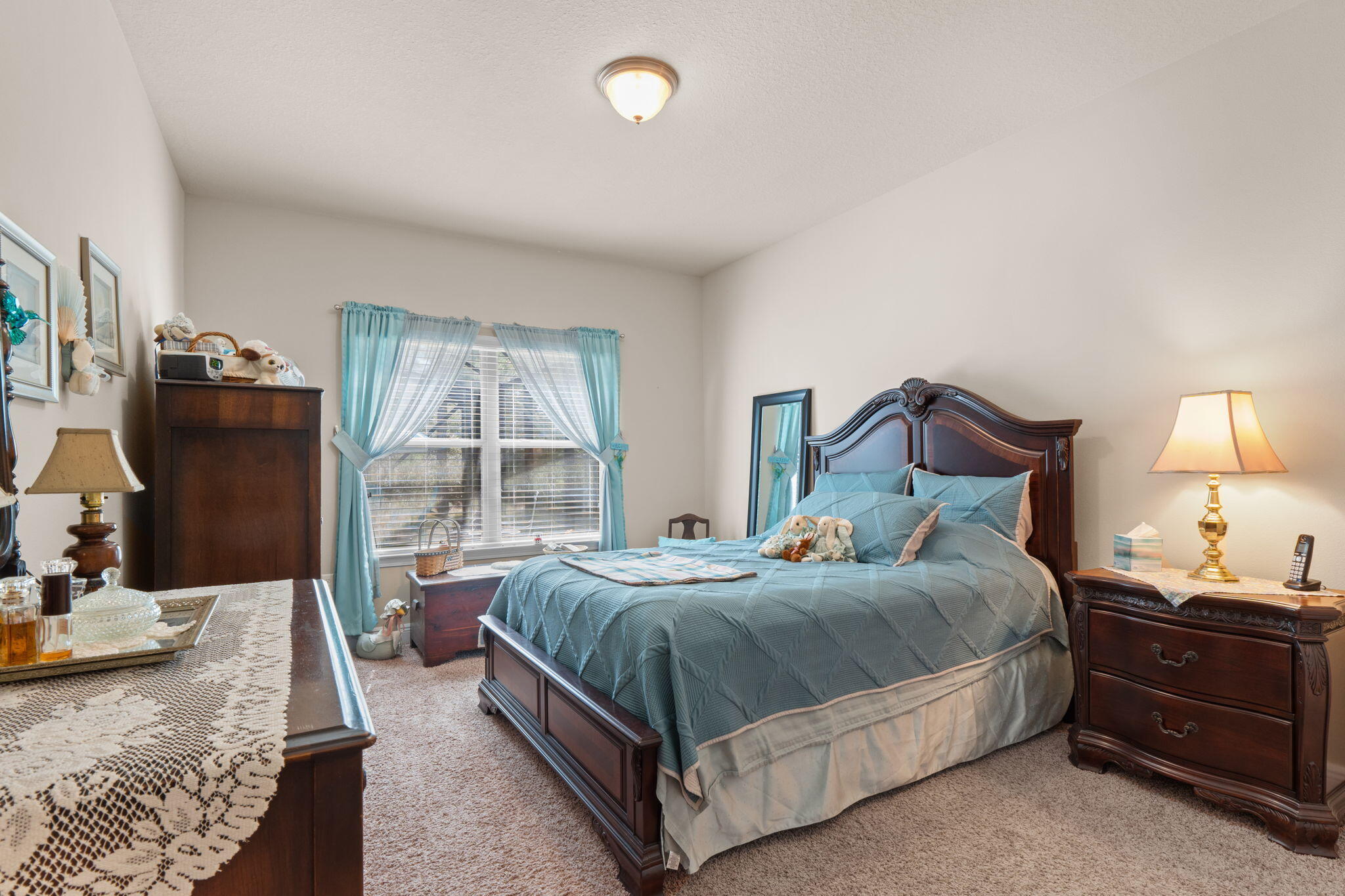 67 Secret Street Freeport, FL 32439 - Photo 30 of 63 a bedroom with a bed and a flat tv screen on dresser