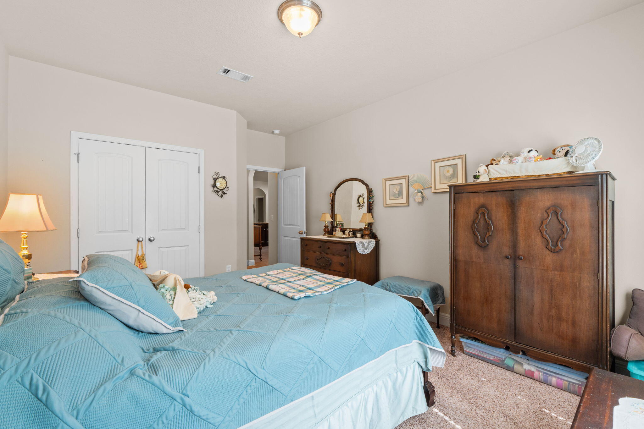 67 Secret Street Freeport, FL 32439 - Photo 32 of 63 a bedroom with a bed and a mirror