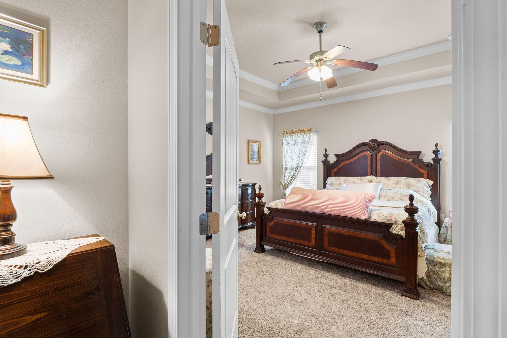 67 Secret Street Freeport, FL 32439 - Photo 37 of 63 a bedroom with a bed and a chandelier