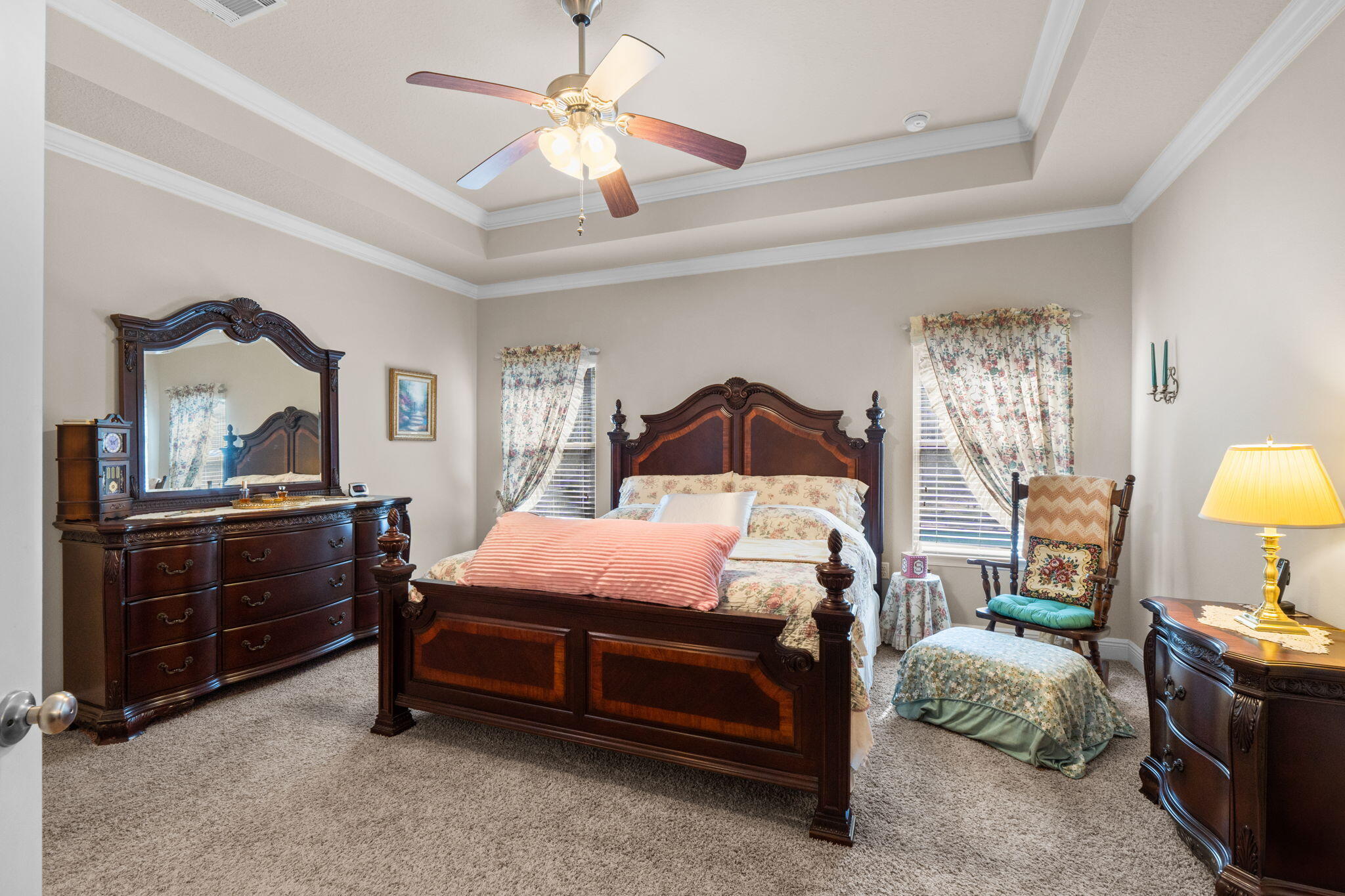 67 Secret Street Freeport, FL 32439 - Photo 38 of 63 a bedroom with a bed and a chandelier