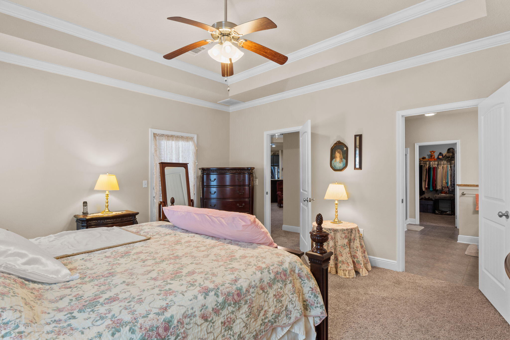 67 Secret Street Freeport, FL 32439 - Photo 40 of 63 a bedroom with a bed and a chandelier