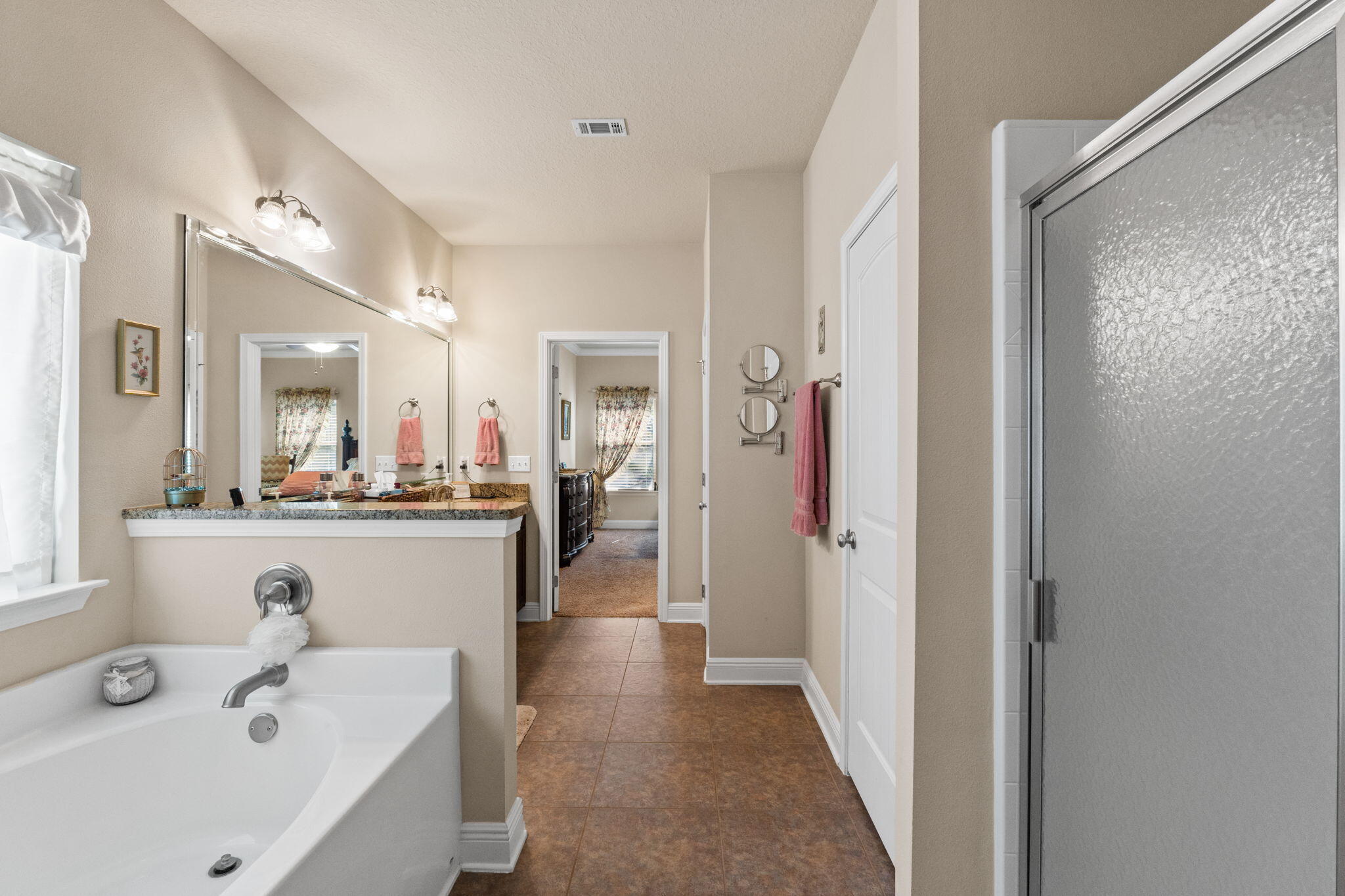 67 Secret Street Freeport, FL 32439 - Photo 44 of 63 a bathroom with a sink a mirror and a shower