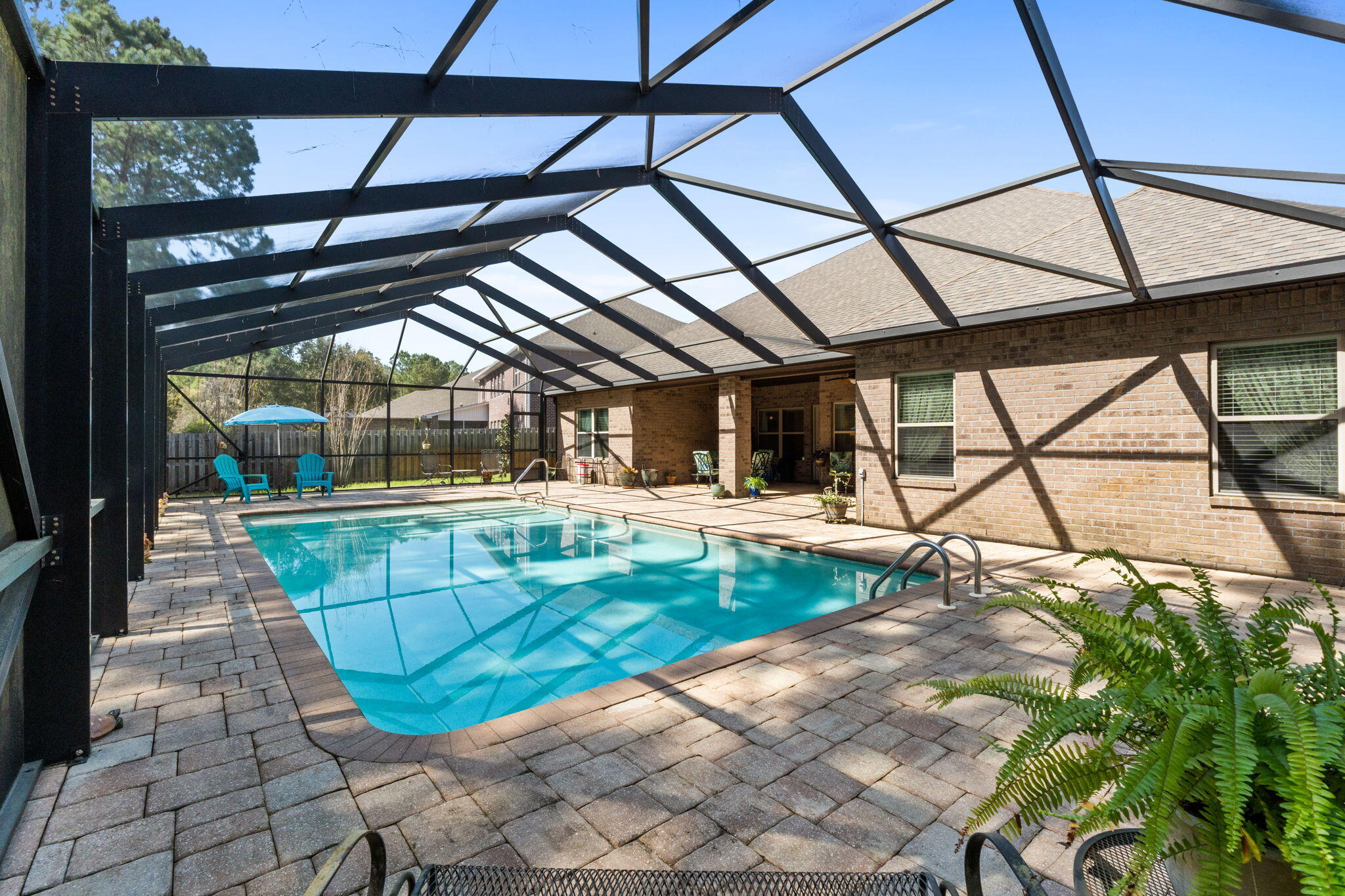 67 Secret Street Freeport, FL 32439 - Photo 54 of 63 a view of a swimming pool with a patio