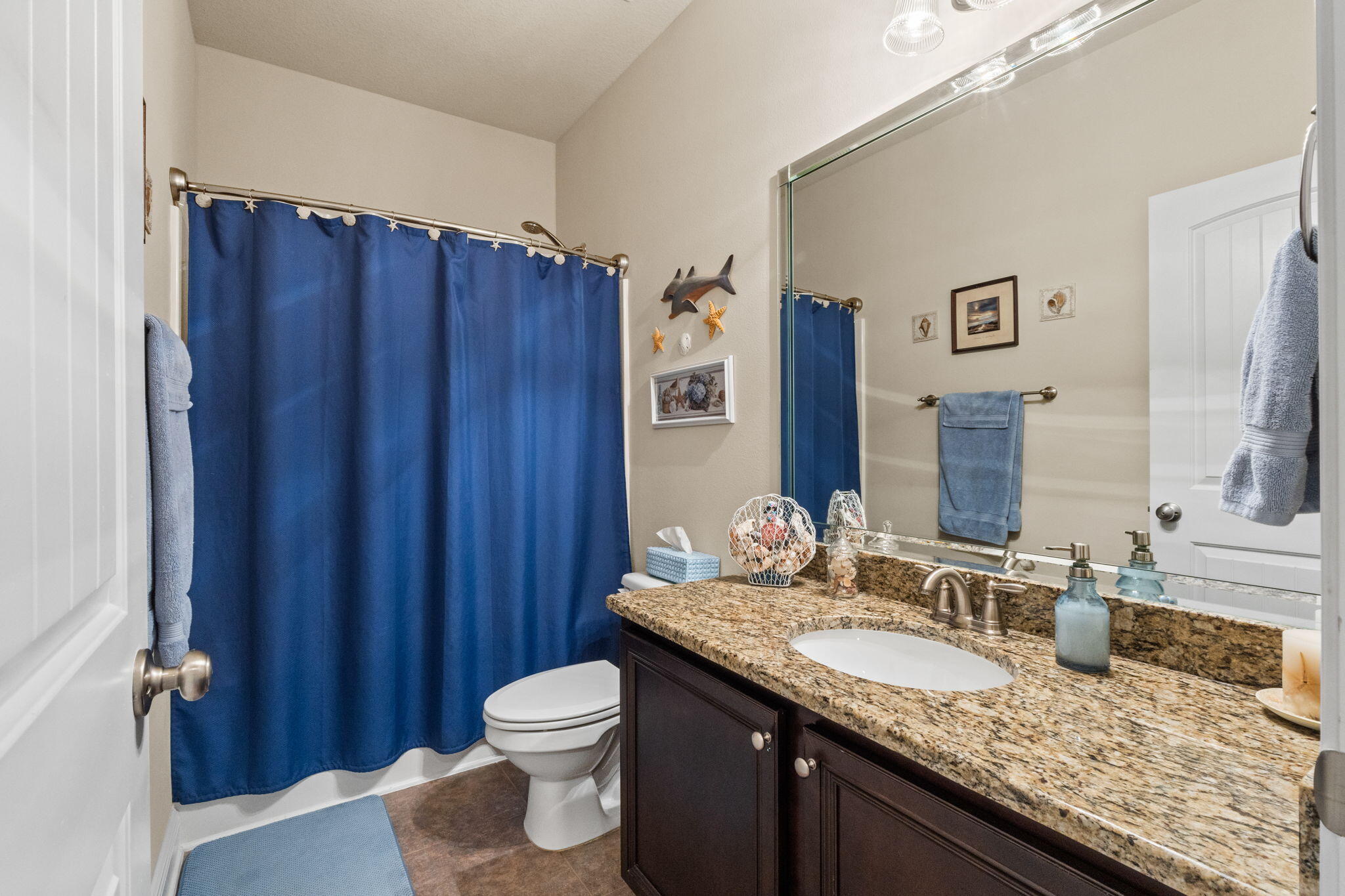 67 Secret Street Freeport, FL 32439 - Photo 58 of 63 a bathroom with a granite countertop sink and a mirror