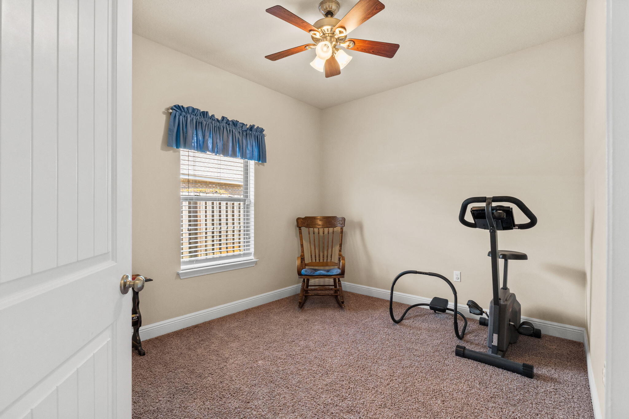 67 Secret Street Freeport, FL 32439 - Photo 59 of 63 a living room with furniture a window and a chandelier
