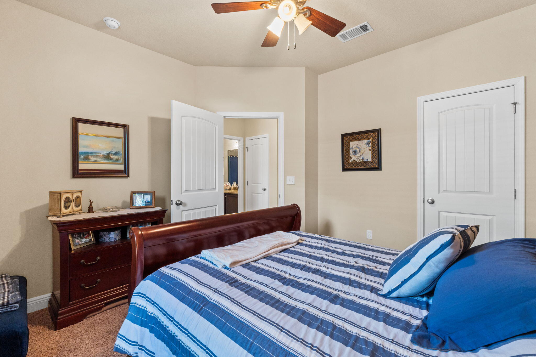 67 Secret Street Freeport, FL 32439 - Photo 63 of 63 a bedroom with a bed and a dresser