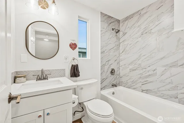 a bathroom with a sink toilet and a bathtub