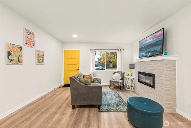 a living room with furniture and a fireplace
