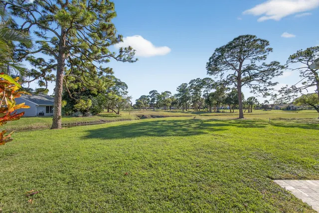 a view of a lake with houses in the back