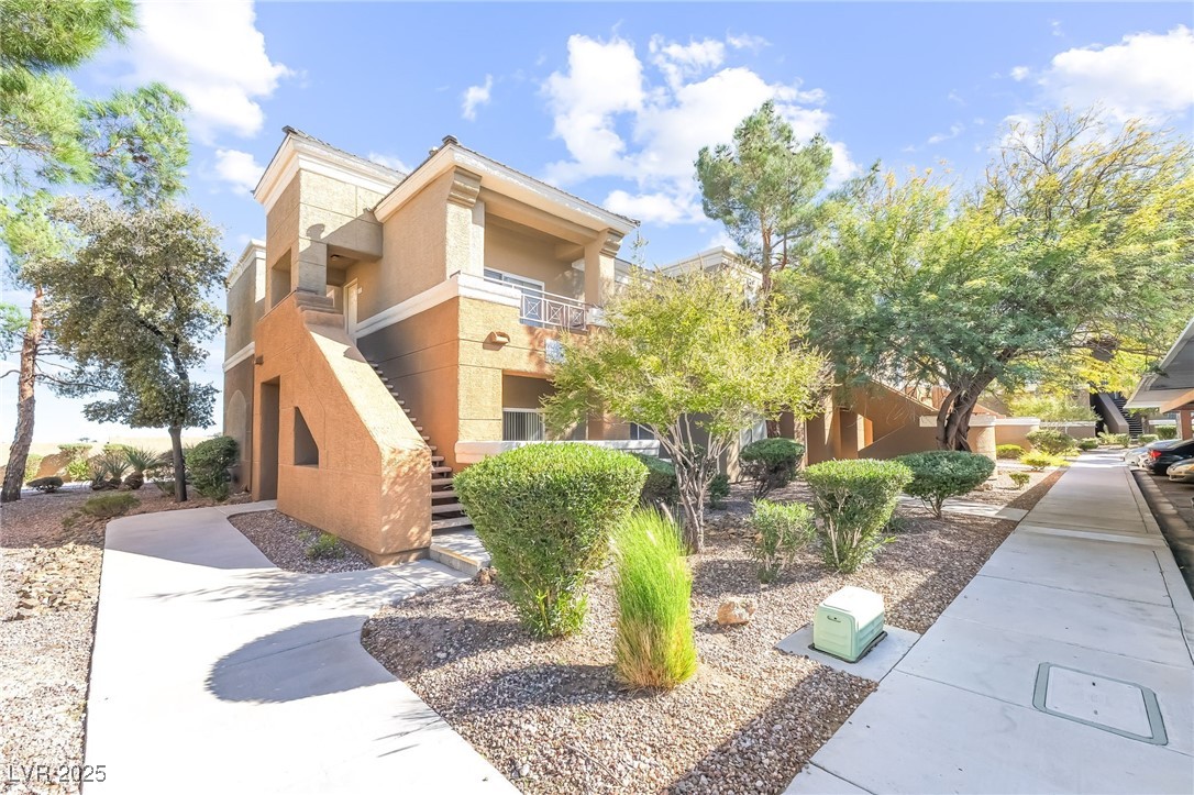 8070 West Russell Road, Unit 1022 Las Vegas, NV 89113 - Photo 3 of 32 View of property featuring stairs