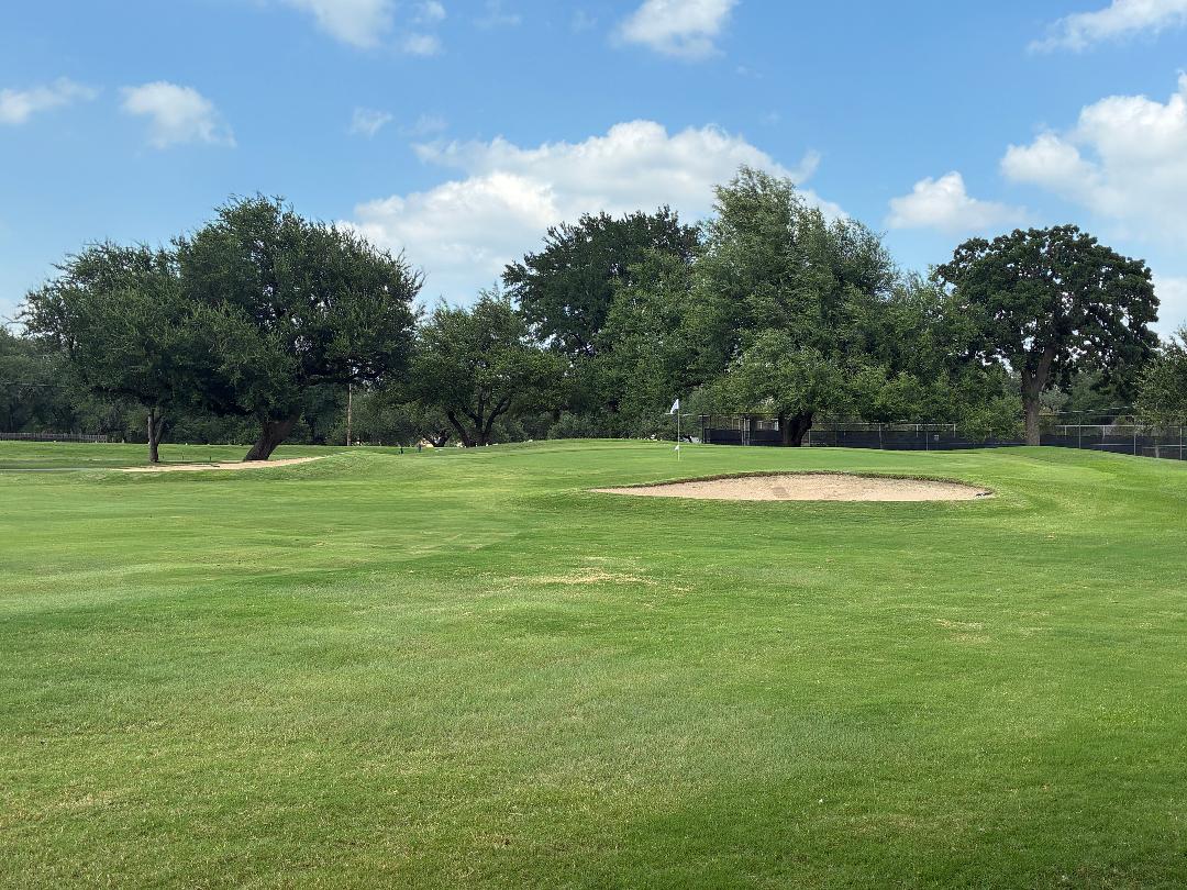 8608 Crest Ridge Circle Austin, TX 78750 - Photo 36 of 38 Green fairways and well-maintained sand traps define this golf course view, perfect for enthusiasts.