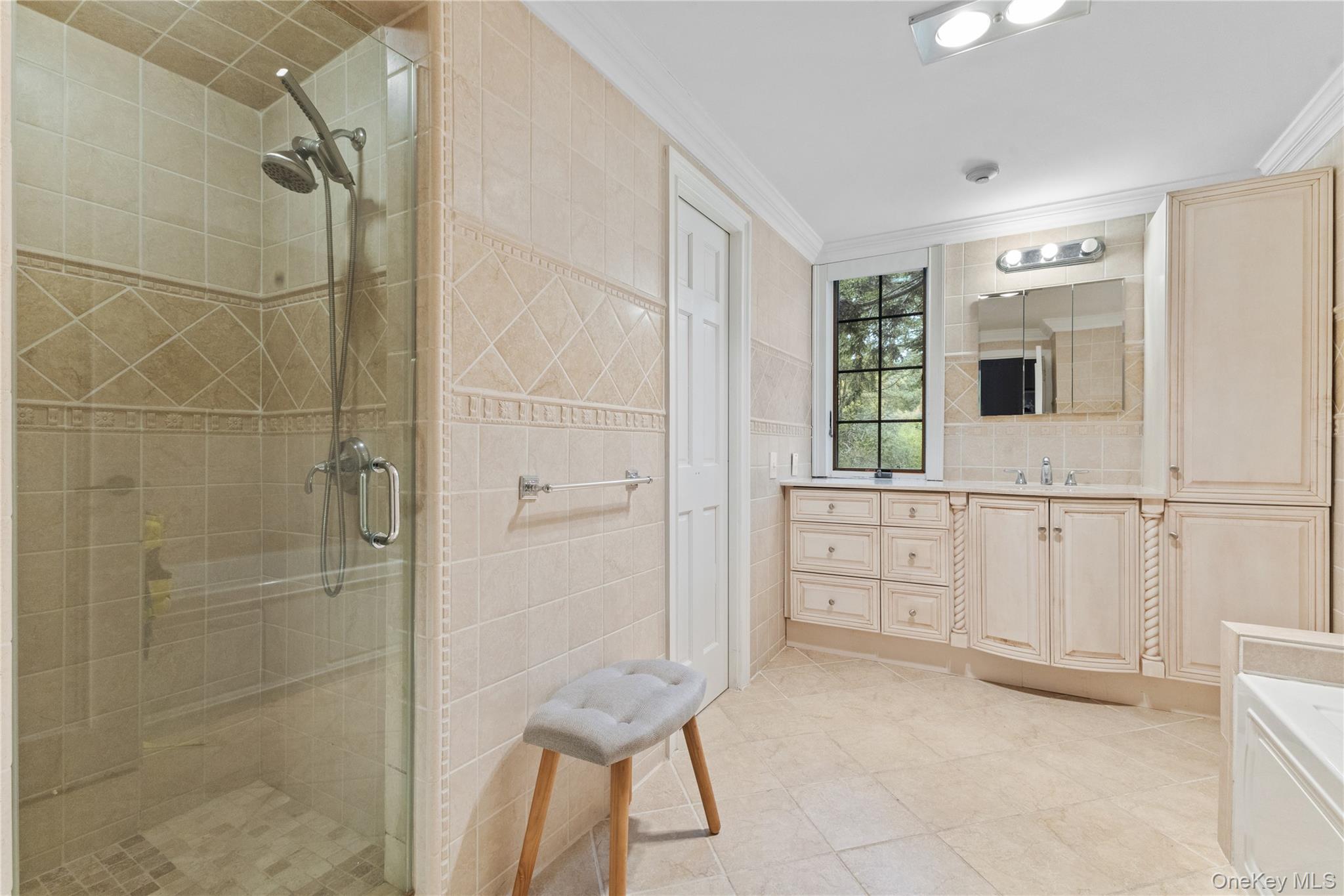 898 Gipsy Trail Road Carmel, NY 10512 - Photo 12 of 42 a bathroom with a shower a sink and a mirror