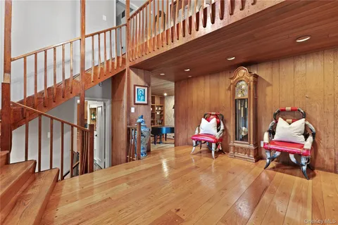 a bed room with a bed and a chair