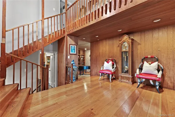 a bed room with a bed and a chair