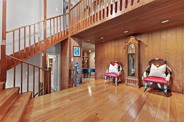 a bed room with a bed and a chair