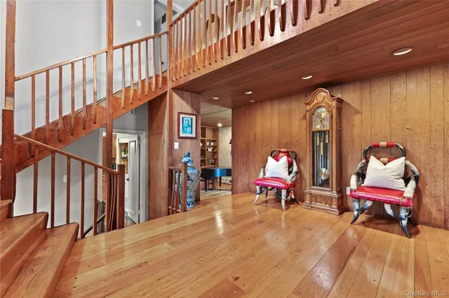 a bed room with a bed and a chair