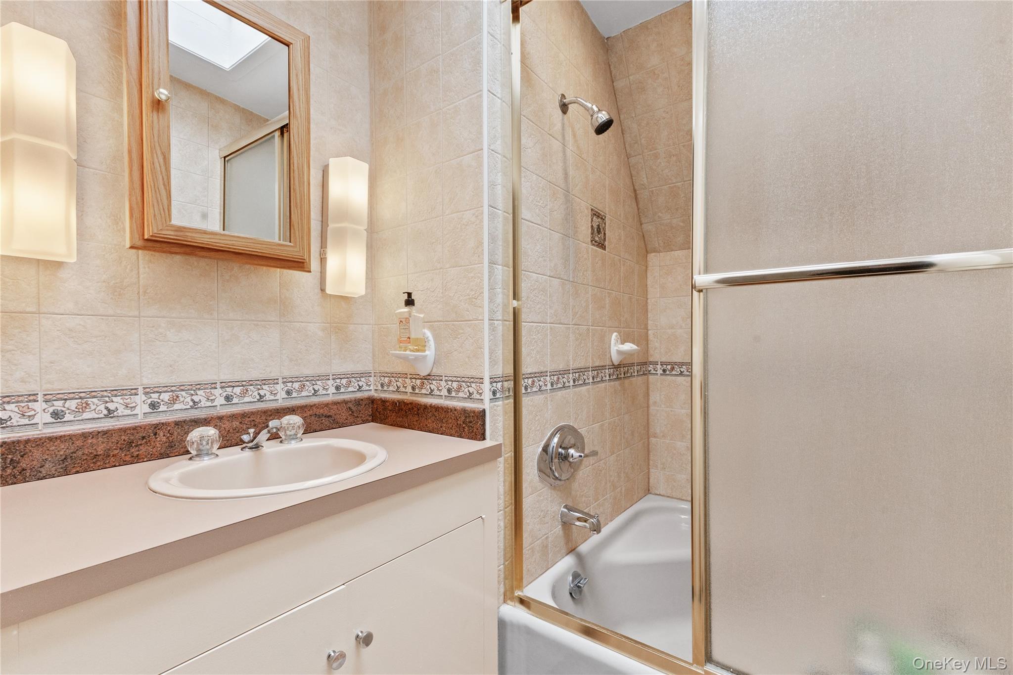 898 Gipsy Trail Road Carmel, NY 10512 - Photo 19 of 42 a bathroom with a sink and a mirror