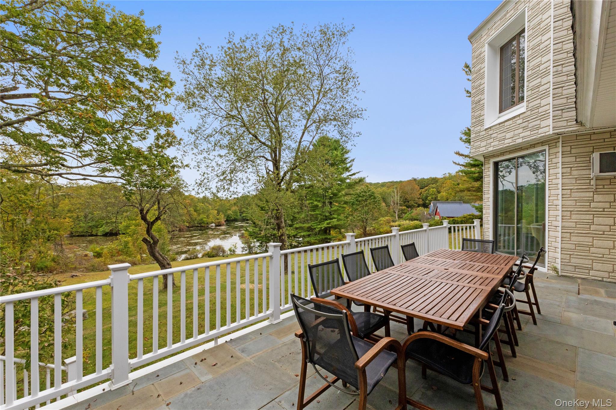 898 Gipsy Trail Road Carmel, NY 10512 - Photo 30 of 42 a view of a table and chairs on the roof deck