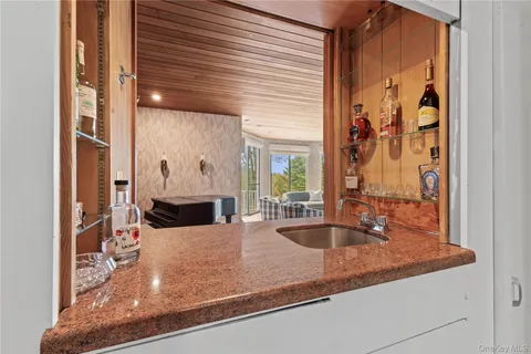 a view of a living room with a large window