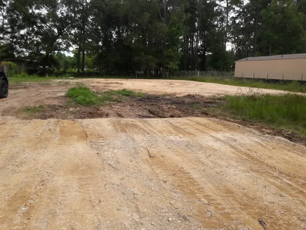 a view of backyard with green space