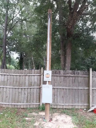 a wooden fence and trees