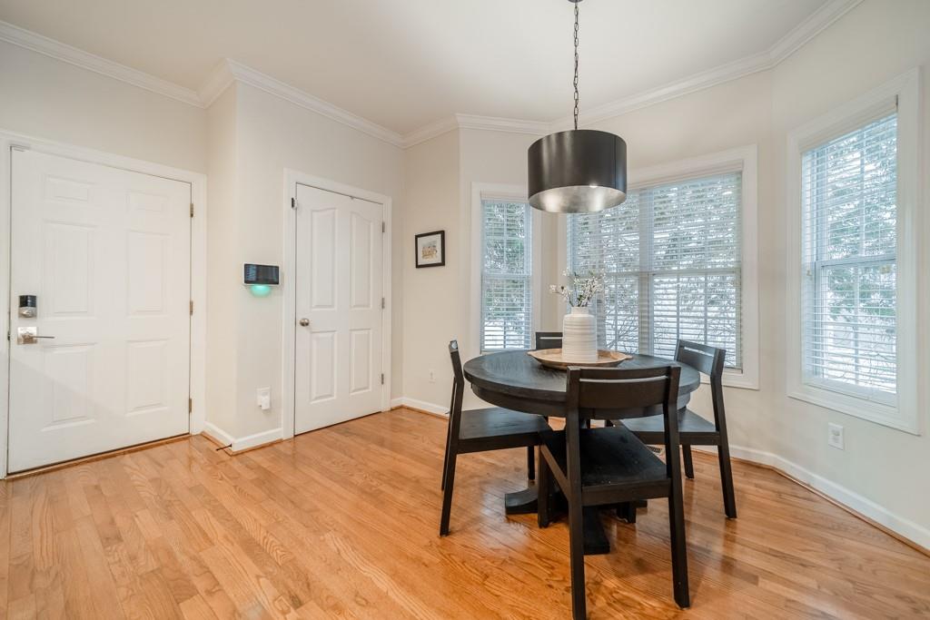 7604 Birchwalk Drive Huntersville, NC 28078 - Photo 13 of 37 a view of a dining room with furniture window and wooden floor
