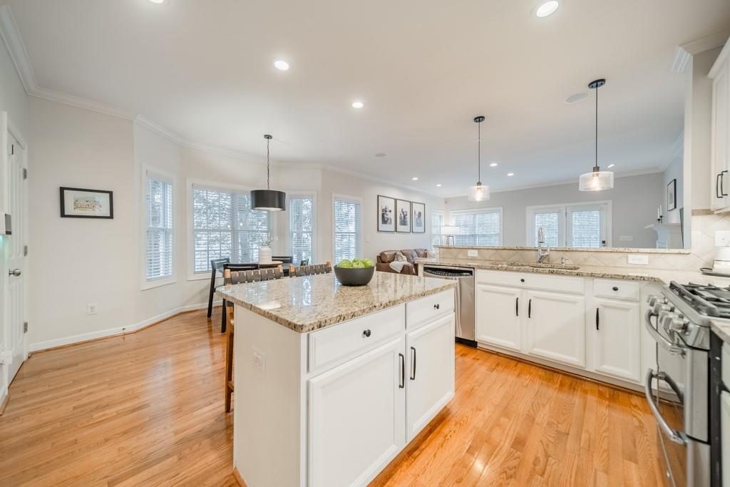 7604 Birchwalk Drive Huntersville, NC 28078 - Photo 16 of 37 a large kitchen with cabinets and wooden floor