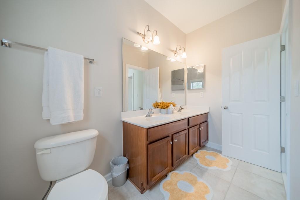 7604 Birchwalk Drive Huntersville, NC 28078 - Photo 20 of 37 a bathroom with a sink toilet vanity and shower