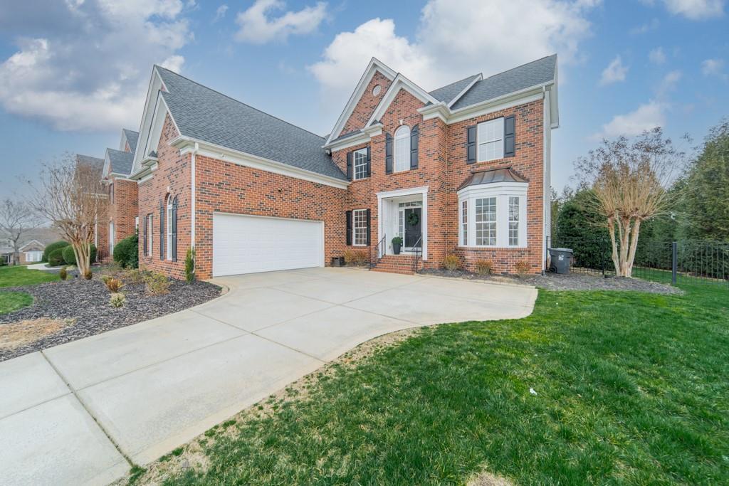 7604 Birchwalk Drive Huntersville, NC 28078 - Photo 2 of 37 a front view of a house with a yard and garage