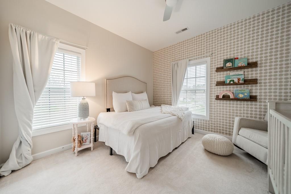 7604 Birchwalk Drive Huntersville, NC 28078 - Photo 21 of 37 a bedroom with bed and a window