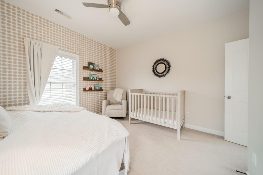 7604 Birchwalk Drive Huntersville, NC 28078 - Photo 22 of 37 a bedroom with a bed and a window
