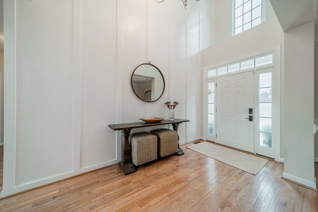 7604 Birchwalk Drive Huntersville, NC 28078 - Photo 5 of 37 a room with wooden floor and a chair