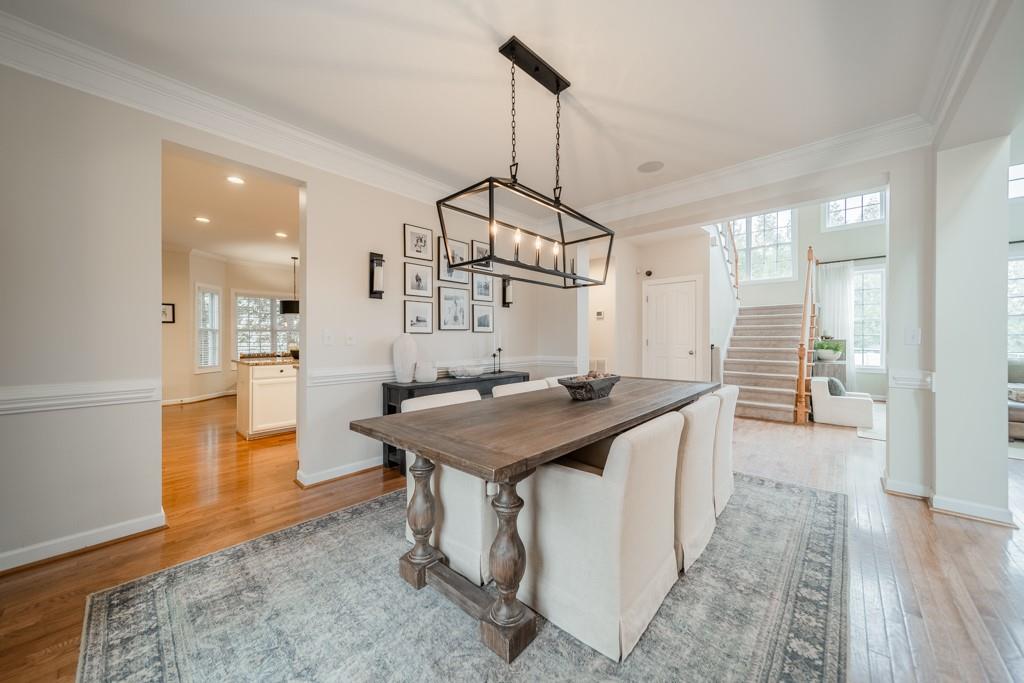7604 Birchwalk Drive Huntersville, NC 28078 - Photo 7 of 37 a kitchen with stainless steel appliances granite countertop a sink a counter space and wooden floor