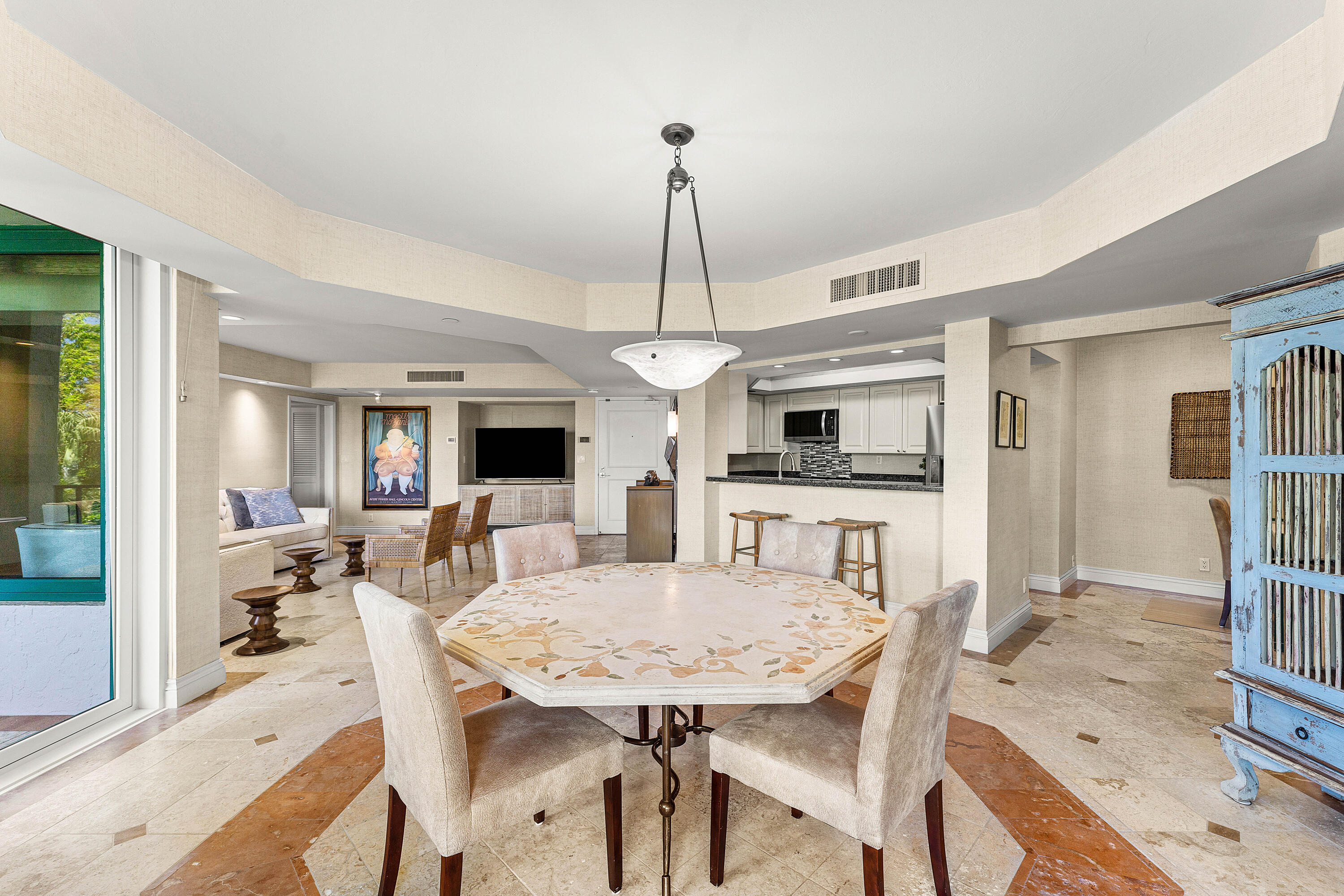 100 Southeast 5th Avenue, Unit 410 Boca Raton, FL 33432 - Photo 14 of 63 a view of a dining room with furniture window and wooden floor
